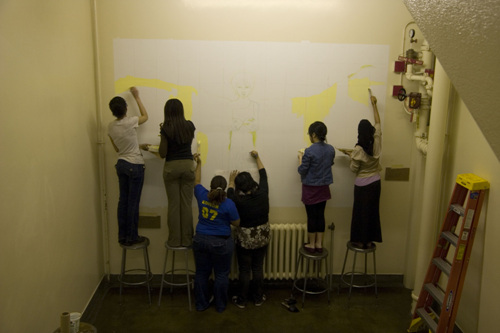 Painting the first layer in yellow